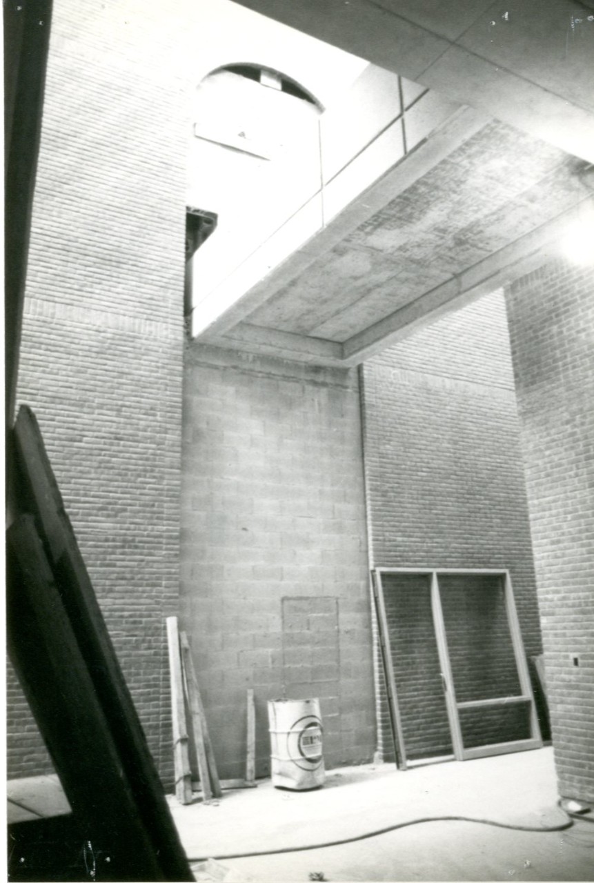 Atrium and admissions entrance under construction.