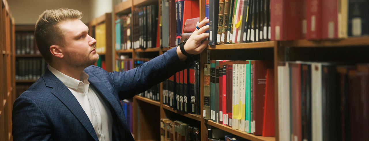 Sean Nuernberger pictured in the College of Law library