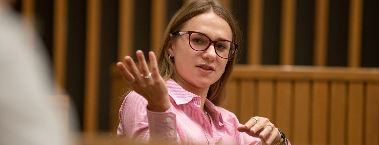 UC Law student participating in a roundtable discussion.