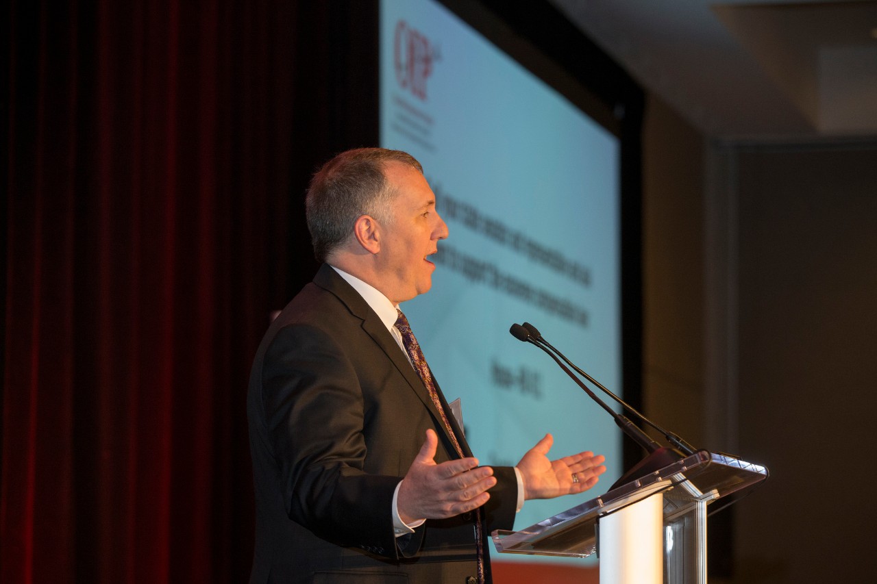 Mark Godsey speaks at OIP's annual donor luncheon.