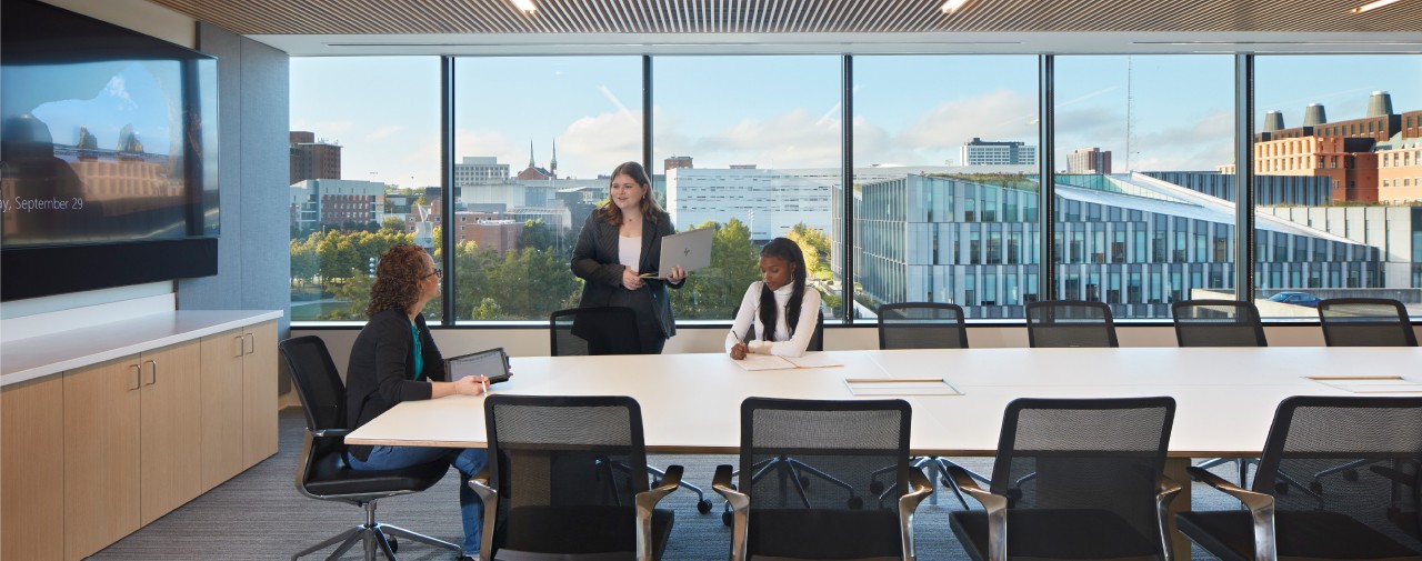 Law students collaborating in conference room.