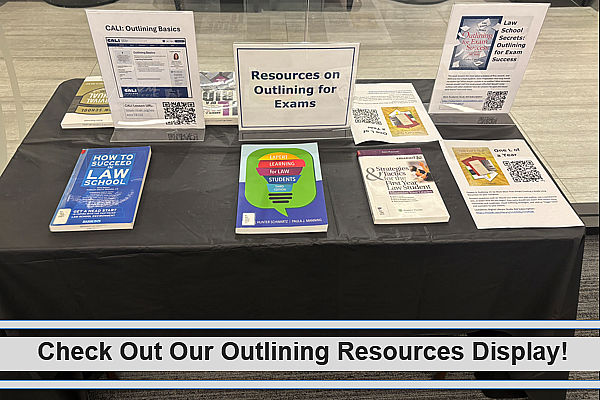 Display on resources on outlining for exams featuring books and CALI Lessons on outlining